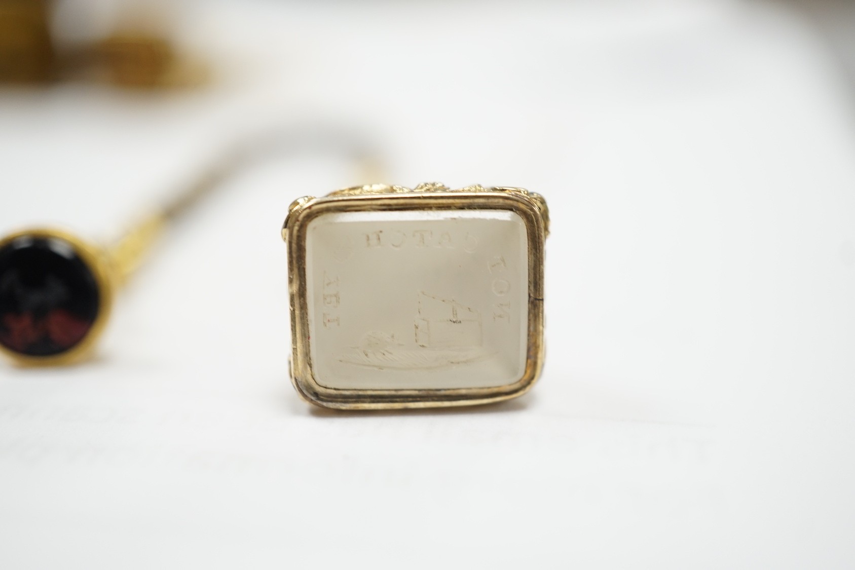 Four assorted 19th century gold plated fob seals, set with citrine, glass or carnelian, largest 30mm.